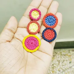 A throwback to the personalized rakhis I make for my brothers every year. These colorful, circular designs are just a few examples of my creations.