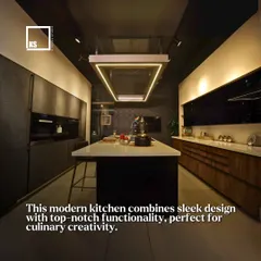 This modern kitchen combines sleek design with top-notch functionality, including an island with an integrated hob and a suspended ceiling light, perfect for culinary creativity.
