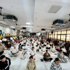 A hall full of participants meditating together during our International Yoga Day event. The collective silence and focus created a powerful, peaceful atmosphere.