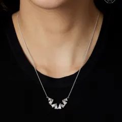 This versatile diamond pendant transforms effortlessly. Here, it is opened out into a longer, striking design, held by hidden magnets.