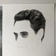 Another progress shot of the Robert Downey Jr. sketch. At this stage, I've started blocking in the dark values around the eyes, establishing the deep-set look that is crucial for capturing his likeness.