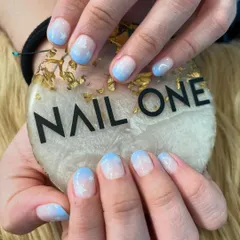 A closer look at the sky-inspired nail art. This design on short, rounded nails is perfect for a subtle yet imaginative look.