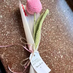 A close-up of a single pink crochet tulip, showing the handwritten "Happy Birthday" tag. Every gift gets a personal touch from me.