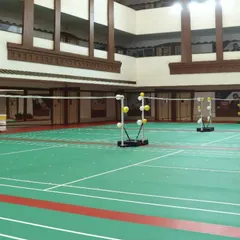 A straight-on view of our courts, highlighting the clear markings and professional nets. This is a space built for serious badminton players.