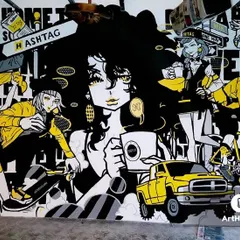 A complex, manga-inspired graffiti mural in a striking black, white, and yellow color scheme. This piece is packed with characters and details, creating an immersive and visually stunning artwork.