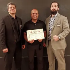 Posing with my Elite MMA Official certificate alongside the respected heads of AIMMAA and GAMMAF. Continuous learning is key.