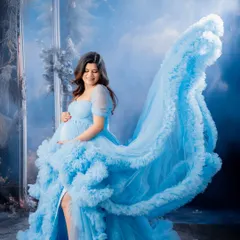 I love creating dynamic and dreamy portraits. The flowing fabric of this light blue gown adds a sense of movement and fantasy, making for a truly ethereal maternity photo.