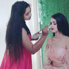 This is me in my element, working on a party glam look. In my course, you get direct guidance as you practice on live models, ensuring you understand every technique, from blending eyeshadow to achieving the perfect lip color.