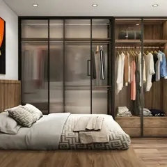 For this bedroom, we integrated a wardrobe with fluted glass doors directly into the layout, providing stylish storage that feels light and open. The wood-paneled headboard and warm tones create a cohesive and inviting space.