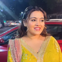 A candid shot of this lovely client, her soft, wavy hair looking effortlessly beautiful for her Kirtan ceremony.
