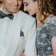 A close-up, candid moment of the couple sharing a happy, intimate embrace during their Sangeet. We capture the unscripted affection that defines your relationship.