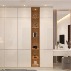 A sleek, minimalist wardrobe design with high-gloss white doors and an integrated open shelving unit in a contrasting wood finish. This unit also includes a built-in dressing table.