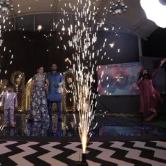 A dramatic entrance with a cold pyro sparkler creating a focal point. This is a fantastic way to add a 'wow' factor to the couple's entry and create a stunning photo opportunity.