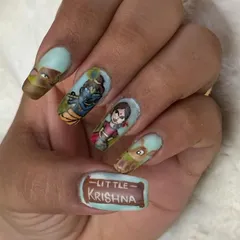 Celebrating Janmashtami with a detailed nail set inspired by the "Little Krishna" series. Each nail features a different character, from Krishna himself to his animal friends.