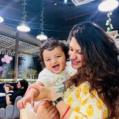 This is what it's all about: a happy mom and her laughing baby enjoying a carefree moment in our cafe. We love seeing our guests become a part of the Angels n Brats family.