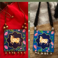 I love how each Kamadhenu, or holy cow, that I paint has its own unique expression. These two pendants, with gold and silver bell accents, showcase the distinct personality that emerges in every handmade piece.