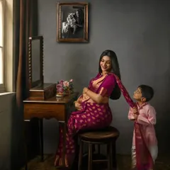 A beautiful narrative portrait of a mother and her son. His playful interaction with her saree tells a story of love, nostalgia, and the excitement of a growing family.