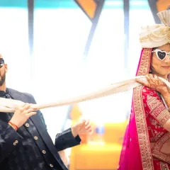 Bringing the fun to wedding portraits. This couple's playful vibe was amazing, and the heart-shaped glasses were the perfect touch for their fun-filled Indian wedding photoshoot.