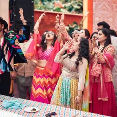 I believe the best moments happen when I jump right into the crowd. Here I am, mid-game at a Haldi carnival, making sure the energy is sky-high and everyone, from the youngest to the oldest, is part of the fun.