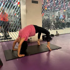 A student in Urdhva Dhanurasana (Wheel Pose) during a gym session. I encourage students to listen to their bodies while exploring their flexibility and strength.