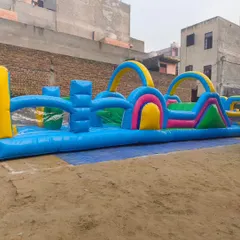 A full view of the new inflatable obstacle course, showcasing its length and the variety of challenges from start to finish.