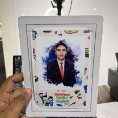 A guest at a 'Bring Your Family to Work' day holds up their custom digital caricature. Our artists create flattering and fun portraits on the spot, which are then printed in a branded frame for a perfect, personalized souvenir.