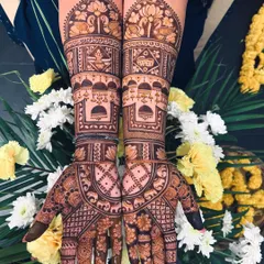 A beautiful bridal design featuring traditional house and wedding ritual motifs. The semi-circular patterns on the palm are filled with delicate elephants and florals.