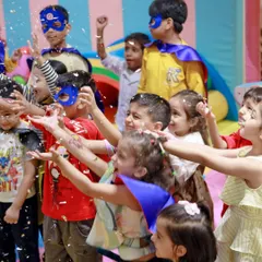 The celebration reaches its peak with a shower of confetti. We provide fun props like superhero capes and masks so every child can feel like part of the action, creating moments of pure, shared joy.