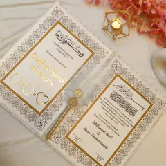 For a classic and elegant look, this white and gold Nikah certificate is a perfect choice. It features beautiful calligraphy and is personalized with the couple's names and wedding date in a golden acrylic finish.