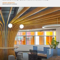 The modern office must embody responsibility to the planet and its people. In the Infosys campus, I used features like this sculptural wooden column to create breakout spaces that are both functional and biophilic, promoting well-being.