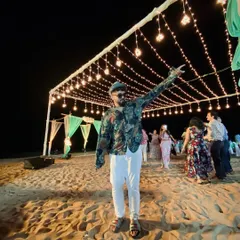 Bringing the party to a destination wedding in Goa. Here I am, pointing to the stars, but really just getting ready for another dance performance on the beach under the beautiful night lights.