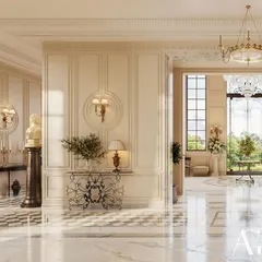Every element is curated to tell a story of artistry. Here, a classical bust on a pedestal and an ornate console table stand against meticulously paneled walls, creating a vignette that speaks to a deep appreciation for historical design within a grand entrance.