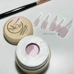 Technique is everything. This shot shows the difference between older brush application methods and my current use of dual forms with structure gel for creating extensions with consistent strength and clean architecture.