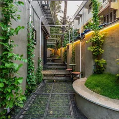 Even the narrowest urban plots can become a green escape. In this Mumbai project, I used vertical climbers and a carefully planned layout to transform a tight alleyway into a lush, functional courtyard space.