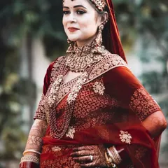A classic, regal portrait of a North Indian bride. My goal here was to highlight the intricate details of her velvet lehenga, traditional matha patti, and heavy bridal jewelry using soft, natural light.