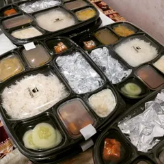 We offer a variety of thali combinations to keep your daily meals interesting. This meal pack features rice, multiple curries, fresh cucumber slices, and a pickle, ensuring a balanced and flavorful experience every time.