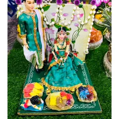 My handmade couple dolls are a popular rental item for weddings and engagements. Dressed in traditional attire, they add a personal and charming touch to your decor, seen here on a lush green display mat.