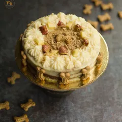This is my super popular Apple and Peanutbutter cake, looking absolutely delicious! I decorate it with creamy frosting, crunchy dog biscuits, and fresh apple pieces. It's a healthy and beautiful centerpiece for any dog party.