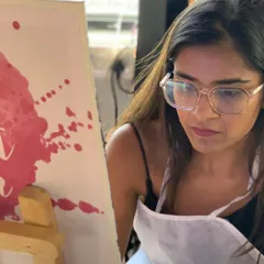 A painter deep in thought, working on her Starry Night canvas. Recreating a masterpiece is a meditative and rewarding process.