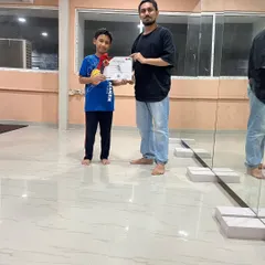 Students from my kids' batch receiving their certificates. I offer certification to validate the hard work and dedication they put into their training.