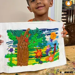 This vibrant garden scene was made entirely with playdough. Working with clay this way allows children to explore 3D concepts and strengthen the small muscles in their hands, all while creating a beautiful story.