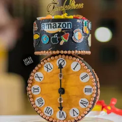 A client requested an anti-gravity cake for a 60th birthday with an antique clock as the showstopper. This was the result, a gravity-defying design where the clock face balances perfectly, surrounded by edible models of the husband's favorite brands and foods.