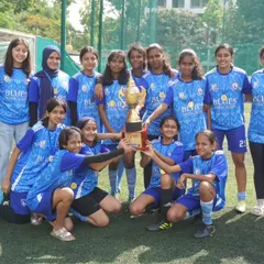 Our Women's Team proudly hoists the runners-up trophy. Every tournament is a chance to win or learn, and we are proud of their fighting spirit.