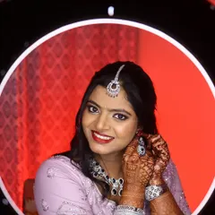Isha, absolutely radiant and ready for her reception party. This shot captures the complete look, with the ring light highlighting the beautiful details of her makeup.