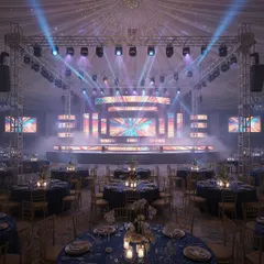This 3D render shows a Sangeet stage integrated with guest seating. The design uses multiple LED screens and a tented ceiling with professional lighting to create a cohesive and spectacular event space.