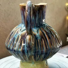 The colors on this pitcher make it one of my favorite pieces. The way the glazes melted and flowed in the kiln created these yummy flashes of blue, purple, and yellow. It’s pure kiln magic.
