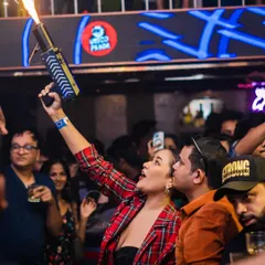 A guest firing a confetti gun into the crowd. I love getting the partygoers involved, making them part of the show and creating an interactive, high-energy nightlife experience.
