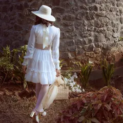 Part of the romantic, story-driven campaign for Starchthelabel. The styling of this tiered white dress, complete with a vintage-style hat and basket, was designed to evoke a sense of poetic nostalgia and timeless femininity.
