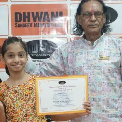 A proud moment for both student and guru. Our senior teacher blesses a young winner, embodying the cherished Guru-Shishya tradition at our institute.