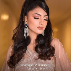 A perfect example of cocktail glam. This look features champagne shimmer eyes, minimal eyeliner, and wispy lashes for a sophisticated and sultry evening style.